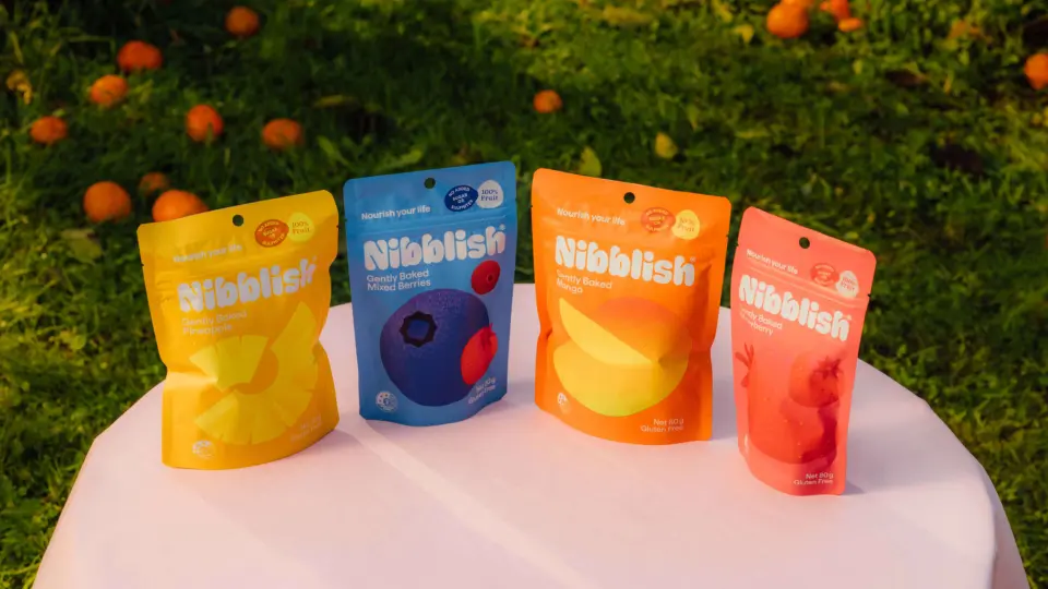 Colourful snack pouches on a table outdoors
