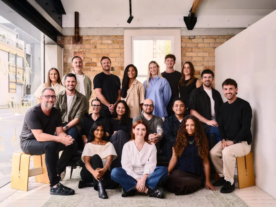 PU team photographed together in a bright studio