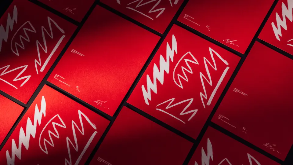 Red patterned printed cards laid out in a grid