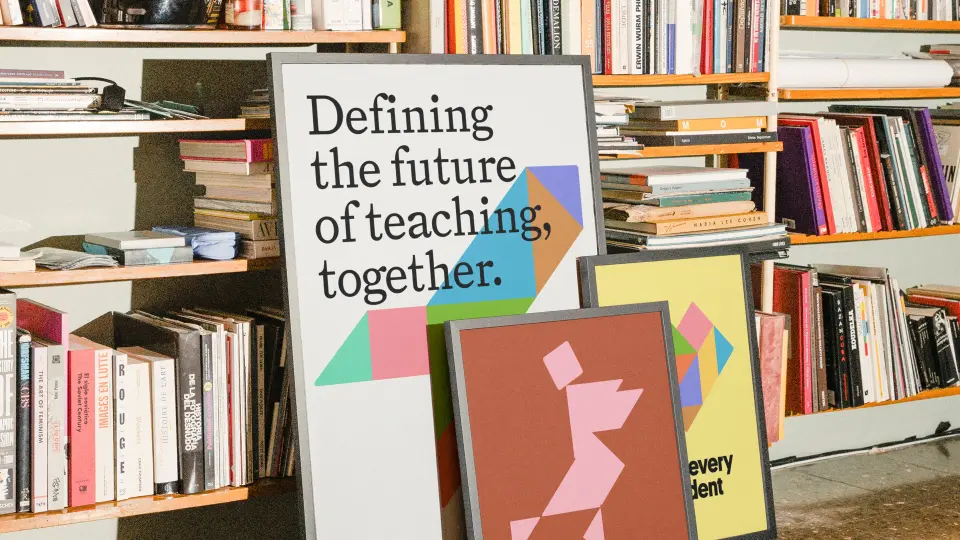 Bookshelf with a poster reading “Defining the future of teaching together”