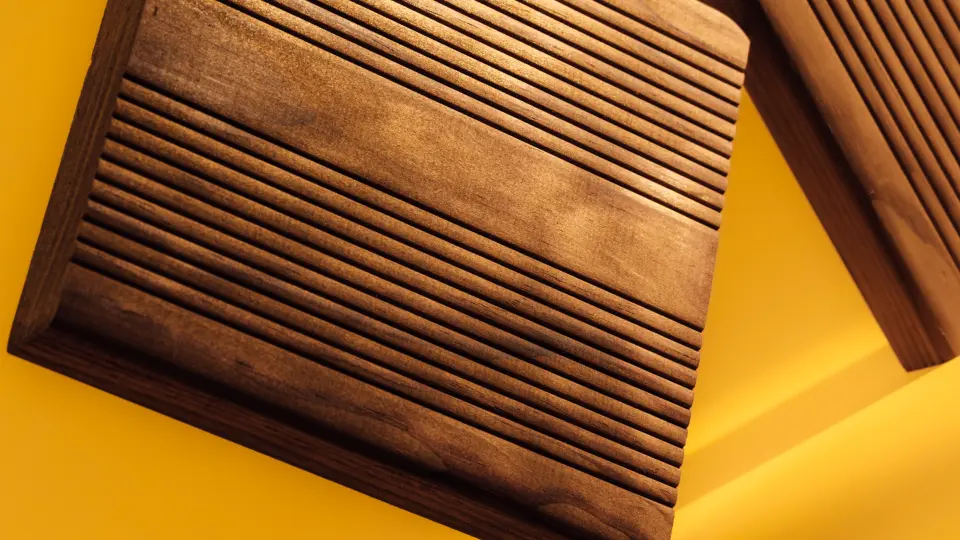 Close-up of wood panelling in warm yellow tones