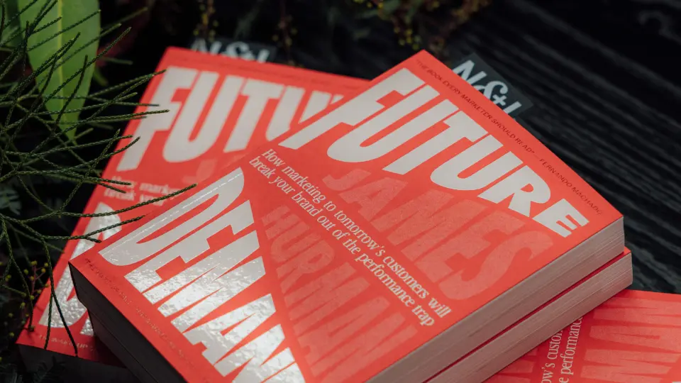 Stack of red printed books with large white lettering