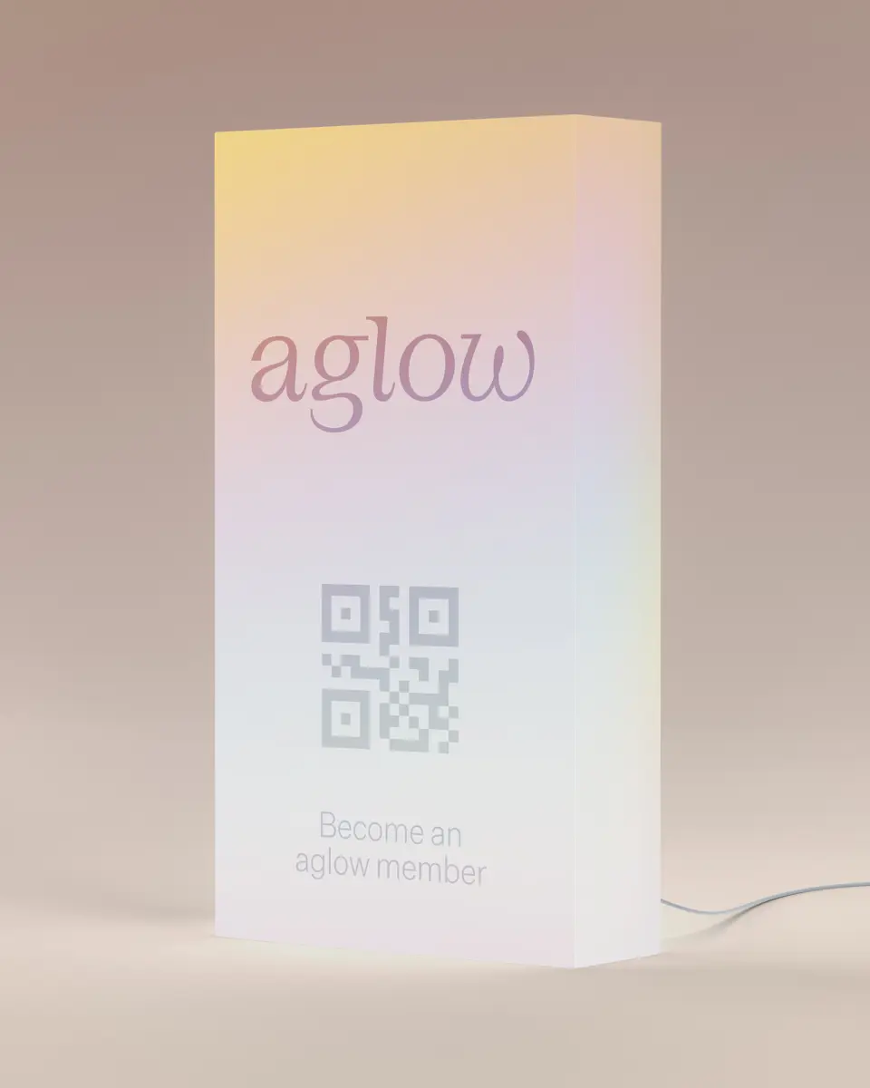 Pack of aglow-branded product in a clear display stand