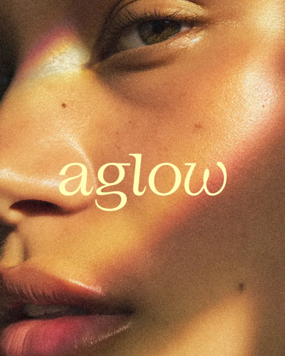Close-up of a woman's face with the aglow wordmark across it