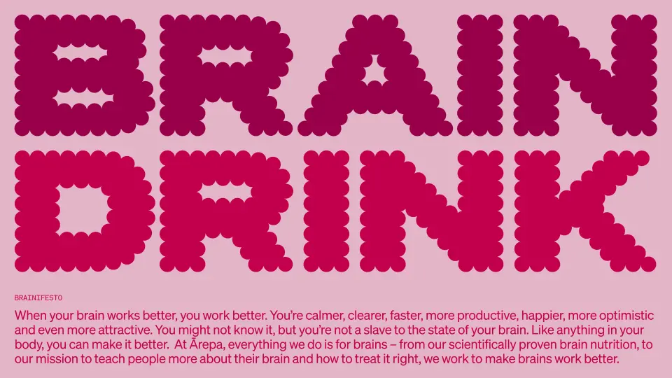 Pink "Brain drink" headline with a short paragraph of body text on a pale pink background