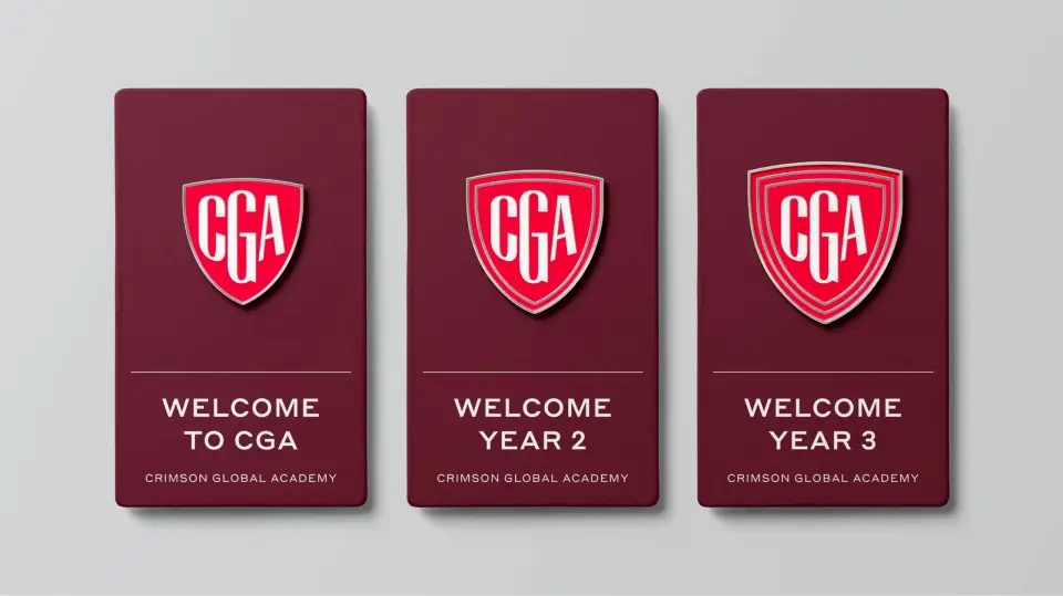 Three Crimson Global Academy welcome cards with the crest