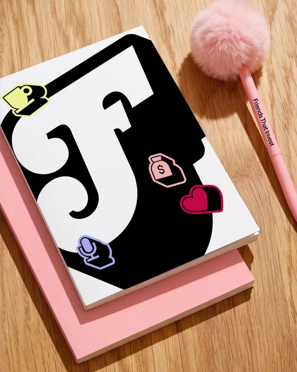 Large black “F” mark on pink paper beside a hammer-style prop