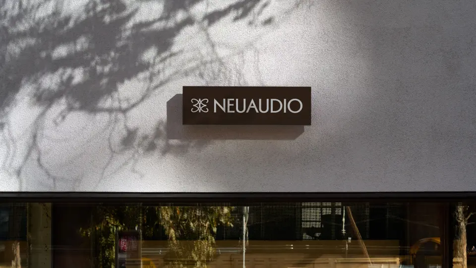 NeuAudio sign on the exterior of a modern building