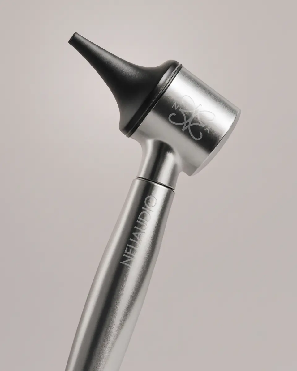 Close-up of a chrome stethoscope-style listening device on a pale background