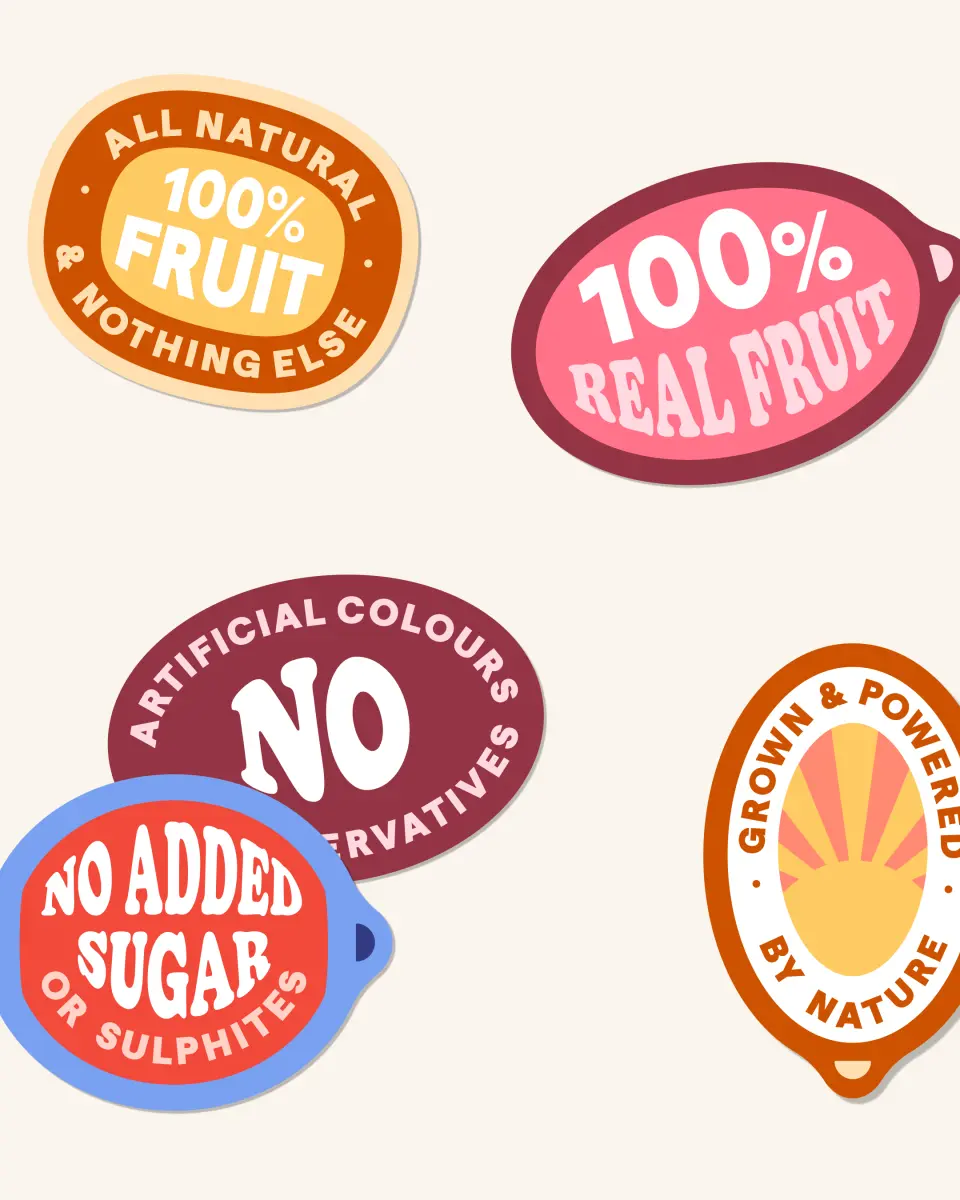 Nibblish stickers reading “100% real fruit” and “No added sugar” on a cream background