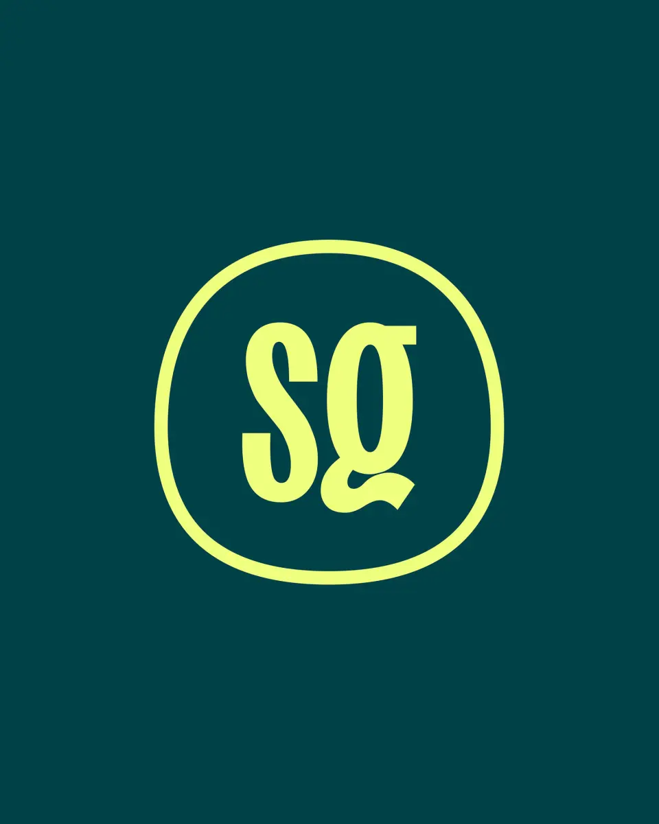 Supergenerous “Sg” monogram in yellow on dark green