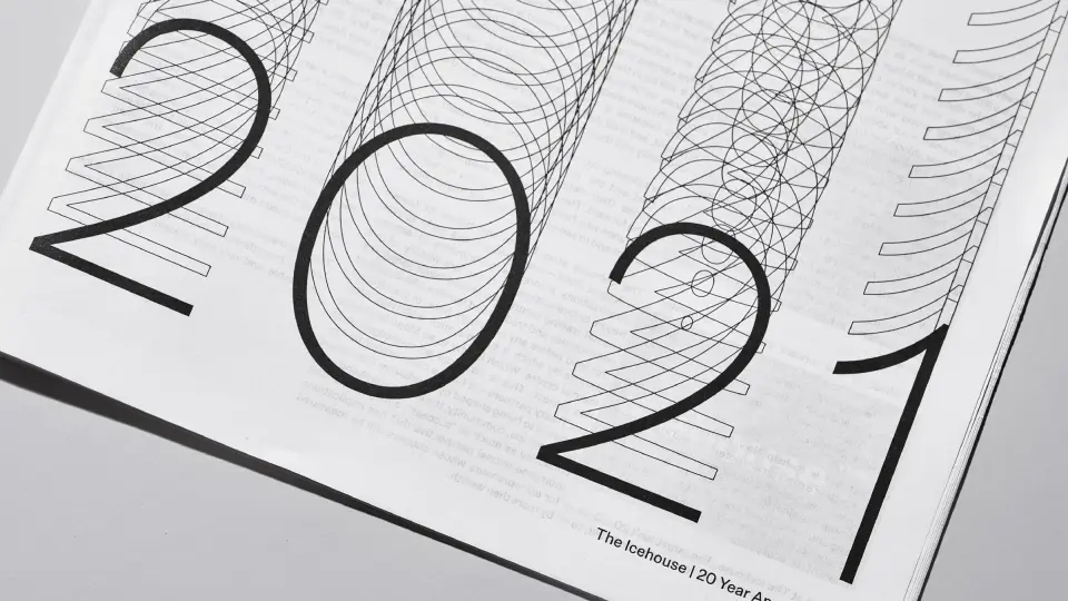 Large “2021” lettering printed on a white page, Icehouse anniversary publication