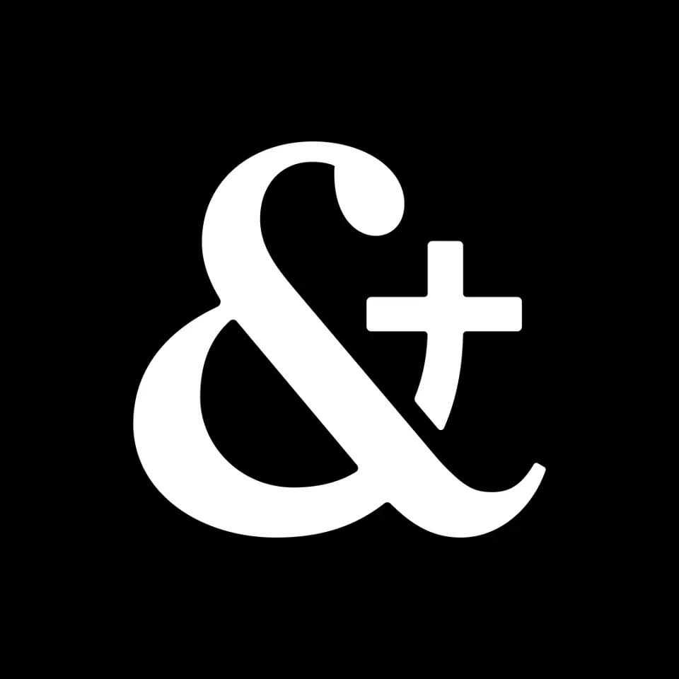 White ampersand and plus mark on black