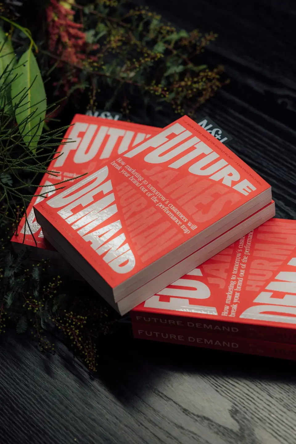 Stack of red printed books with large white lettering