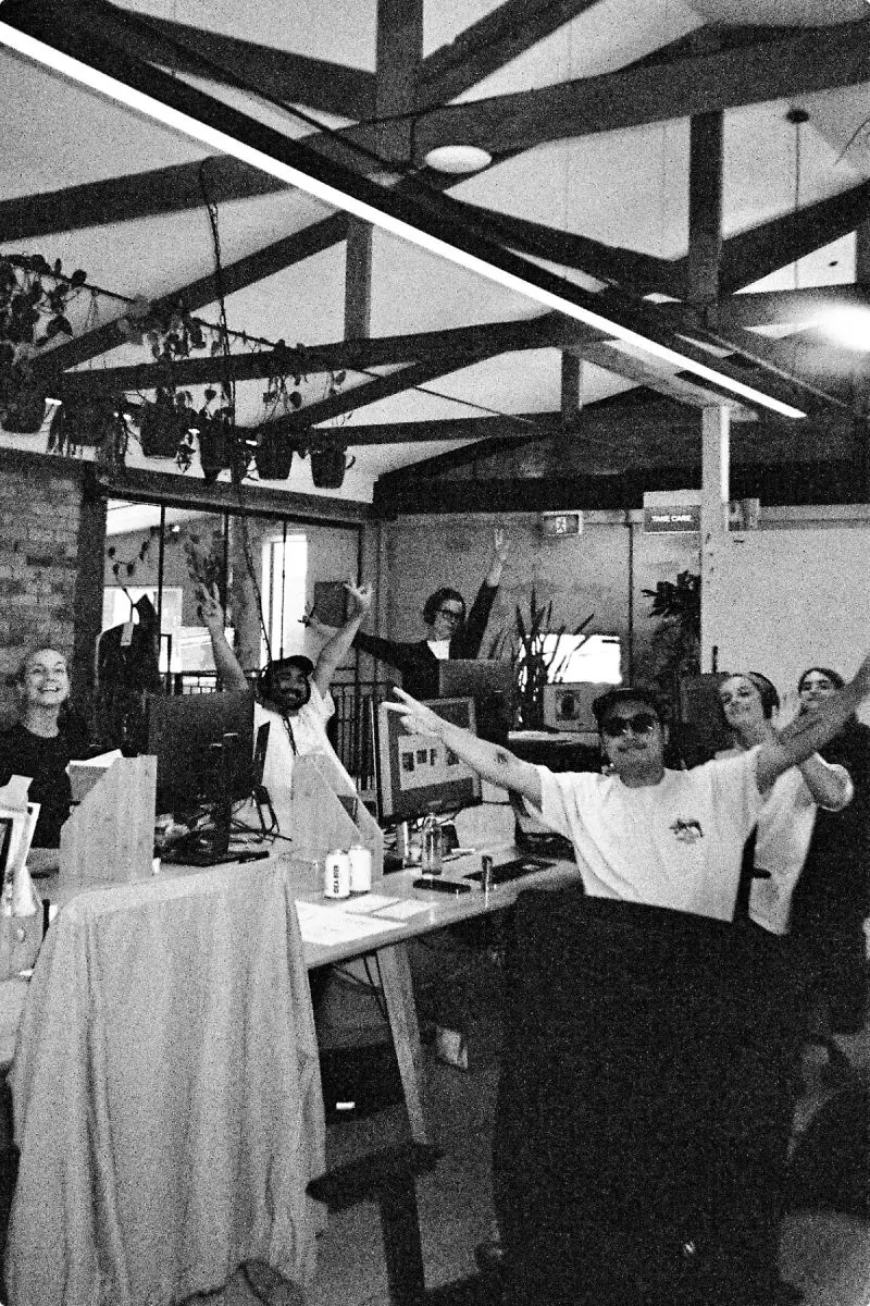 Black and white photo of a busy open-plan office
