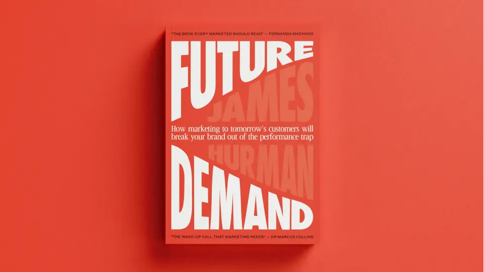 Red “Future Demand” book standing against a red background